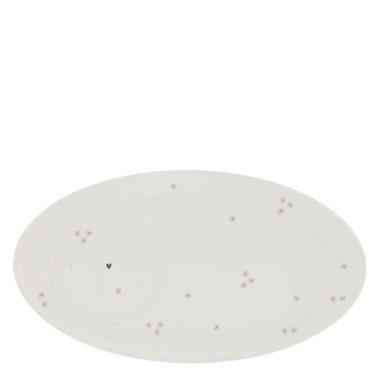 Sous-tasse avec des marguerites